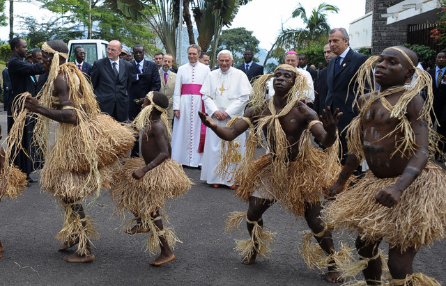 A group of Pygmies from Cameroun's Baka tribe dance for Pope Benedict XVI before he left for Angola to start the second leg of his trip to Africa