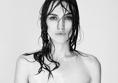 A woman with wet hair and no shirt on