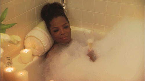 A gif of Oprah in a bathtub