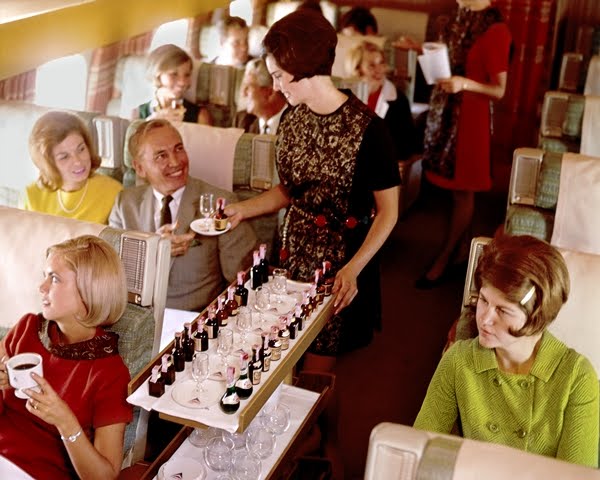 A flight attendant serving passengers