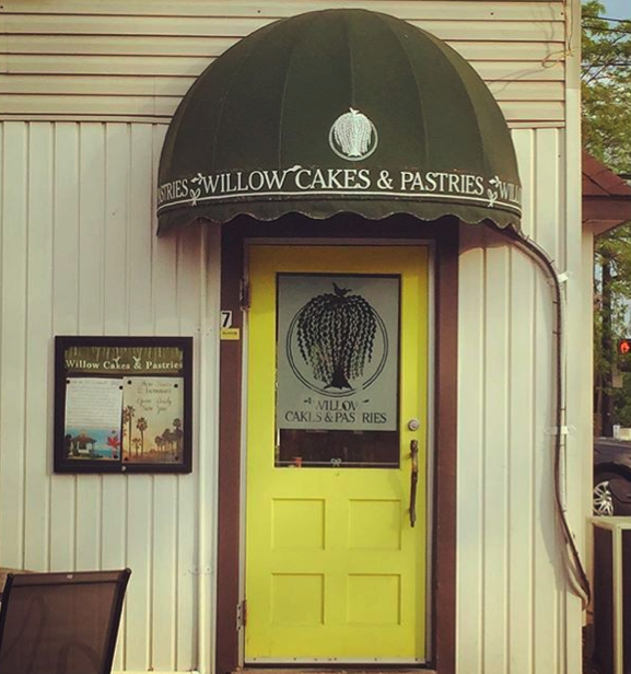 The front yellow door of Willow Cakes and Pastries